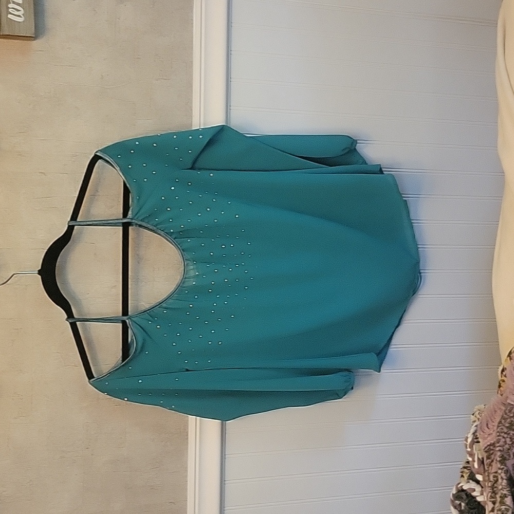 Long sleeved off shoulder semi open back rayon shirt with small metal studs